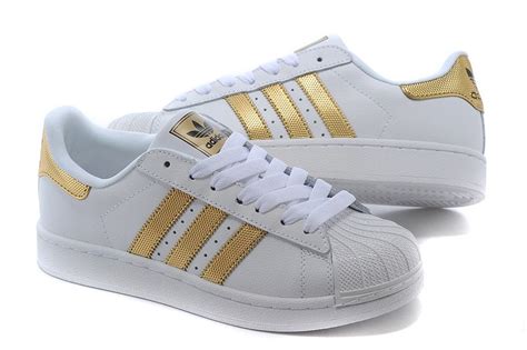 adidas schuhe kinder weis mit rosegoldenen streifen an den seiten|weiße Sneaker für Kinder .